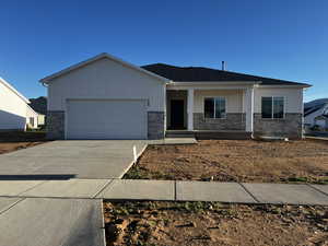 View of front facade featuring a garage