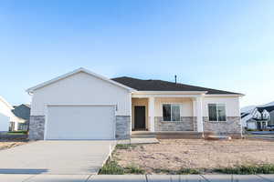 View of front facade featuring a garage