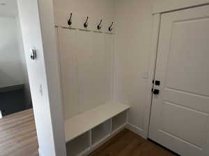 Mudroom featuring wood-type flooring