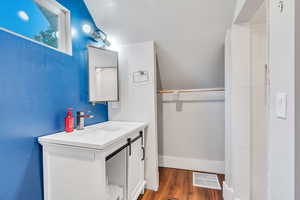 Bathroom featuring wood-type flooring and vanity