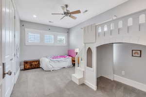 Bedroom with light carpet and ceiling fan