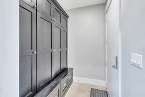 Mudroom featuring light tile patterned floors