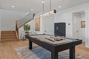 Recreation room featuring pool table and light hardwood / wood-style flooring