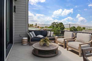 View of patio / terrace featuring a mountain view and an outdoor hangout area