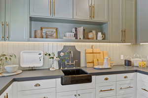 Kitchen with white cabinets and sink