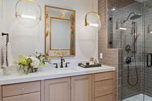 Bathroom featuring vanity and walk in shower