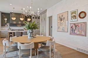 Dining room featuring a chandelier and light hardwood / wood-style floors