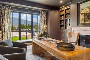 Office area with built in features, carpet flooring, and a mountain view