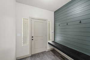 Entryway space featuring dark wood-type flooring