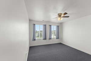 2nd upstairs bedroom with carpet and ceiling fan