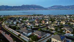Aerial view featuring a water and mountain view