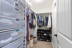 Walk in closet with carpet