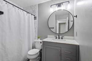 Bathroom with vanity and toilet