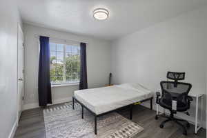 Bedroom with hardwood / wood-style floors