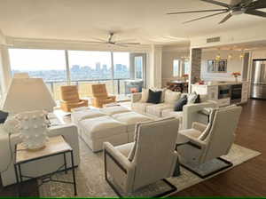 Living room with city and mountain views.