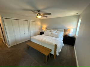 Second bedroom featuring multiple closets and ceiling fan. Has it's own attached bathroom.