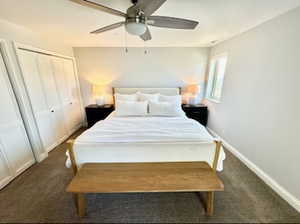 Second bedroom featuring a closet and ceiling fan