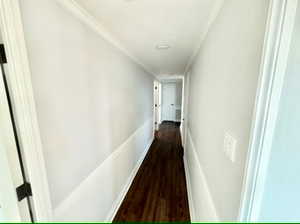 Hallway between primary bedroom and other 2 bedrooms.