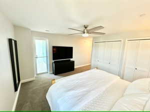 Second bedroom with two closets and ceiling fan, Deck access shown.