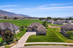 Birds eye view of property with a mountain view