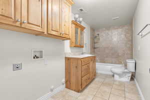 Basement full bathroom with laundry hookups. Bathroom 2