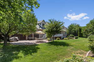 View of yard with a patio area