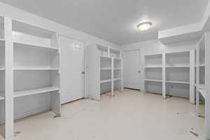 View of storage. Door on the right is a utility room. Door on the left leads to more storage.