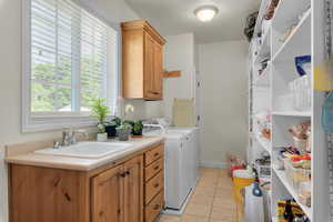 Off the kitchen and can be used as the pantry/laundry room.