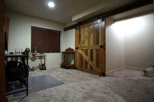 Basement Landing and Flex Room Featuring Grand Barn Door