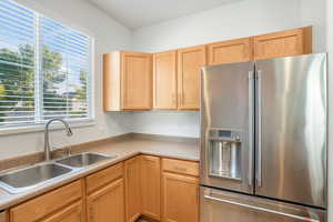 Kitchen featuring sink and high end refrigerator