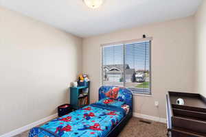 Bedroom featuring carpet floors