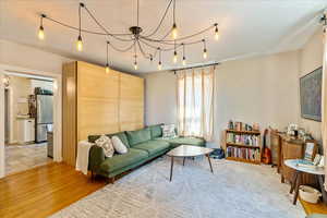 Living room with light hardwood / wood-style floors