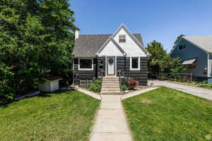 Bungalow-style home featuring a front yard