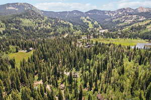 Property view of mountains featuring a water view