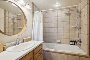 Bathroom featuring vanity and shower / bath combo