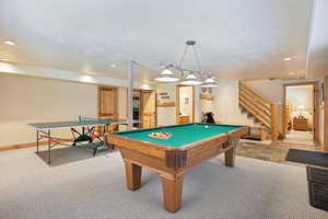 Rec room with light colored carpet and billiards