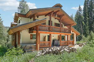 Rear view of house featuring a balcony