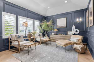 Living area featuring vaulted ceiling