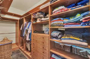 Walk in closet with tile patterned floors