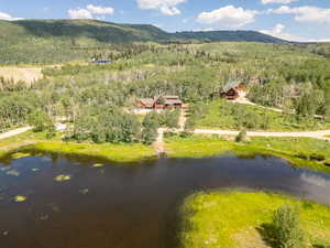 Bird's eye view with a water and mountain view