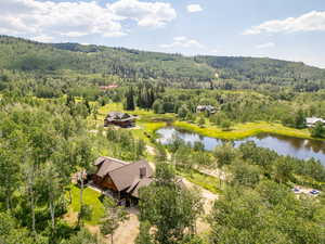 Birds eye view of property featuring a water view