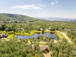 Aerial view with a water and mountain view