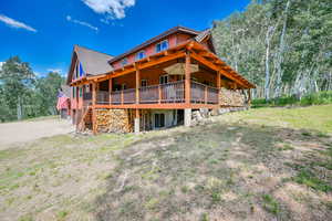 Back of house featuring a deck