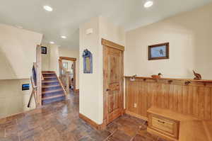 Interior space with dark tile patterned floors