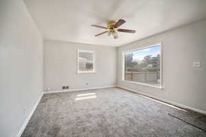 living room featuring carpet floors and ceiling fan