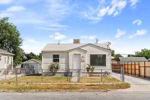 Bungalow-style house featuring a front yard