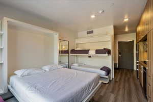 Bedroom featuring dark hardwood / wood-style floors