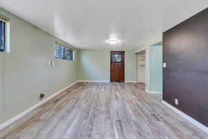 Interior space featuring plenty of natural light and light hardwood / wood-style flooring