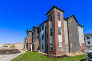 View of building exterior featuring a mountain view