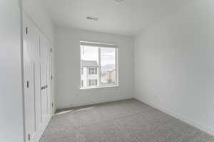 Unfurnished bedroom with carpet